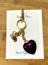 Load image into Gallery viewer, Gold keychain with purple heart charm on a white card with text