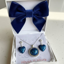 Load image into Gallery viewer, Blue bow tie and jewelry set in a white box with 'Mocs N More' branding.