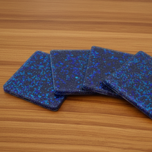 Load image into Gallery viewer, Blue glittery coasters on a wooden surface