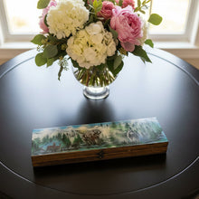 Load image into Gallery viewer, Wooden box with a painted design of animals in a forest on a wooden surface.