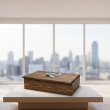 Load image into Gallery viewer, Wooden box with a metal eagle emblem on a workshop table