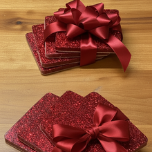 Load image into Gallery viewer, Red glittery gift boxes with ribbons on a wooden surface