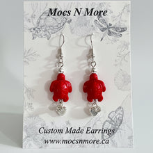 Load image into Gallery viewer, Red custom-made turtle charm earrings on a Mocs N More branded card.
