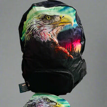 Load image into Gallery viewer, Backpack and pouch with eagle design on a cardboard surface