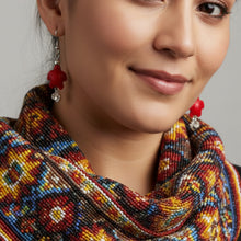 Load image into Gallery viewer, Red custom-made earrings on a Mocs N More branded card.