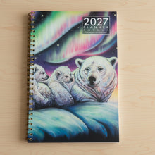 Load image into Gallery viewer, 2021 planner with a colorful design of a bear and rainbow patterns on a reflective surface.