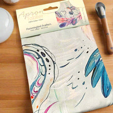 Load image into Gallery viewer, Packaged product with colorful design on a desk next to a keyboard