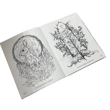 Load image into Gallery viewer, An open art book or coloring book lying on a gray tabletop, showing two black-and-white illustrated rabbit designs on the pages.