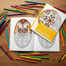 Load image into Gallery viewer, Coloring book with geometric designs on a marble surface