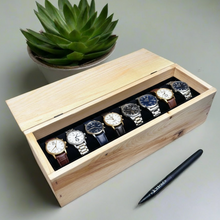 Load image into Gallery viewer, Wooden box with six watches on a light surface with a pen and plant in the background