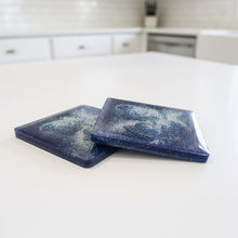 Load image into Gallery viewer, Two blue square coasters on a white countertop with a blurred kitchen background