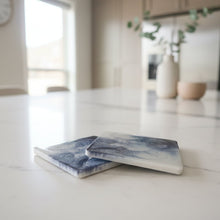 Load image into Gallery viewer, Marble-patterned coasters on a wooden surface