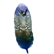 Load image into Gallery viewer, A glossy decorative feather with a blue, green, and purple gradient, resting on a light-colored cardboard surface.