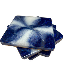 Load image into Gallery viewer, Blue and white marbled coasters on a light surface with a blurred background