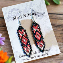 Load image into Gallery viewer, Beaded earrings on a Mocs N More branded card with flowers in the background
