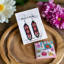 Load image into Gallery viewer, Beaded earrings on a card with &#39;Mooz N More&#39; branding on a wooden surface