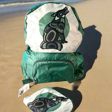 Load image into Gallery viewer, Green backpack and pouch with a black and blue design on a sandy beach.