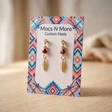 Load image into Gallery viewer, Angled close-up of the earring card on wood