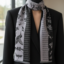 Load image into Gallery viewer, Close-up of original scarf design on black jacket