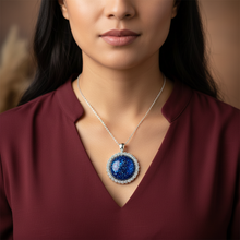 Load image into Gallery viewer, Courage Pendant on Indigenous model - burgundy blouse