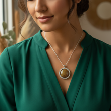 Load image into Gallery viewer, Daring Pendant on Indigenous model - forest green blouse
