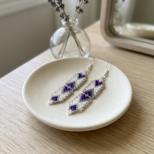 Load image into Gallery viewer, Earrings on an ivory dish with lavender in the background