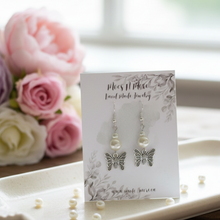 Load image into Gallery viewer, Earrings on jewelry tray with flowers
