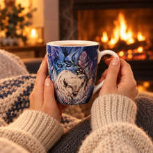 Load image into Gallery viewer, Hands holding the Spirit Buffalo mug by a fireplace