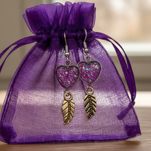 Load image into Gallery viewer, Hummingbird earrings on purple organza bag
