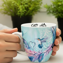 Load image into Gallery viewer, Hummingbird Mug Hands Shot - Mug Visible
