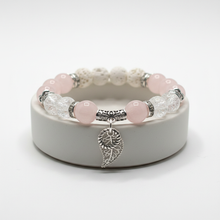 Load image into Gallery viewer, Fancy Feather Rose Quartz bracelet on ceramic dish