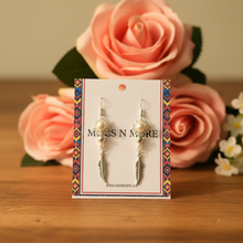 Load image into Gallery viewer, Pearl flower and feather earrings on wood table with pink roses
