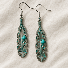 Load image into Gallery viewer, Turquoise Feather Drop Earrings on ivory linen