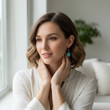 Load image into Gallery viewer, Light turquoise sparkle teardrop earrings lifestyle shot
