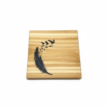Load image into Gallery viewer, Spirit Wings cedar coaster with feather and birds design on white background