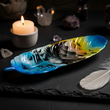 Load image into Gallery viewer, Decorative feather-shaped plate with a colorful design on a dark surface with candles and crystals.