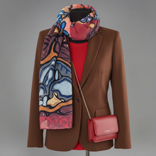 Load image into Gallery viewer, White blazer with a colorful scarf and red handbag on a gray background