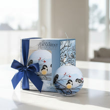 Load image into Gallery viewer, Decorative glass ornament with chickadees on branches, displayed with packaging.
