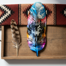 Load image into Gallery viewer, Colorful feather on a wooden tray with a patterned fabric background