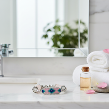 Load image into Gallery viewer, Rose quartz bracelet in bathroom setting - variation 2
