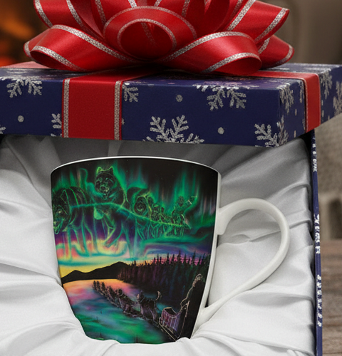 Decorative mug with a scenic design in a gift box with a red ribbon, set against a warm fireplace background.
