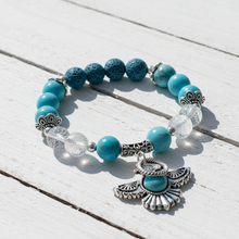 Load image into Gallery viewer, Turquoise Thunderbird bracelet on white board