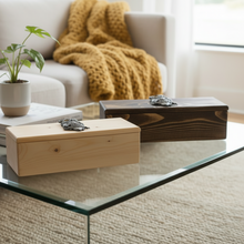 Load image into Gallery viewer, Two wooden boxes on a glass coffee table with a cozy living room background.
